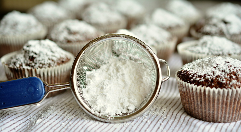 indoors, sweetness, no people, sweet, white sugar, textile, relaxation, icing sugar, focus on foreground, chocolate, focus, nibble, coconut, close-up, table
