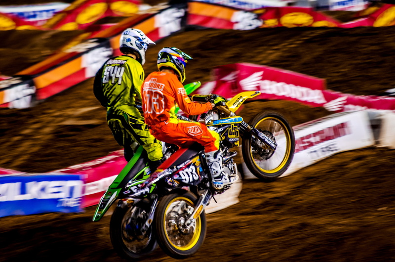 road, motorcycles, transportation, outdoors, track, land vehicle, sport, day, people, headwear, equipment, motocross, communication, helmet, motion, ride