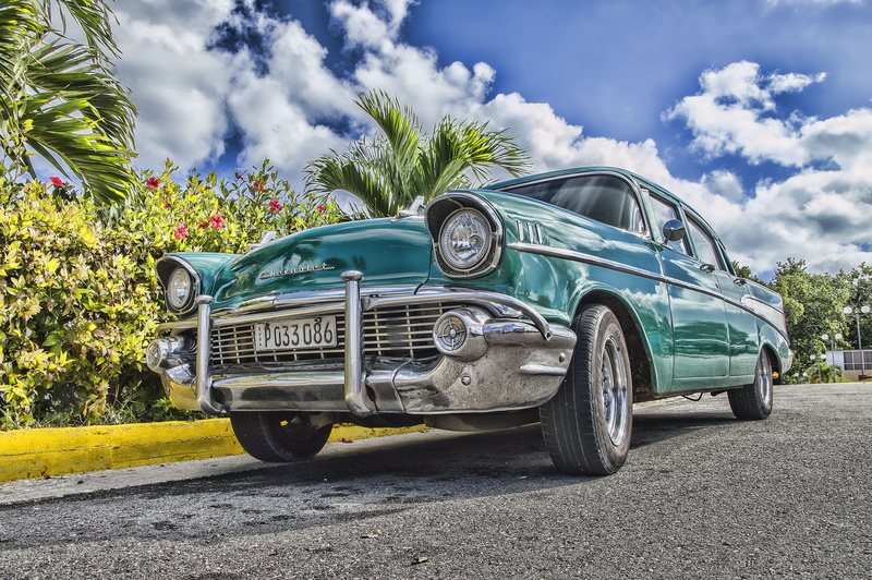 pavement, antique, asphalt, mode of transportation, classic, teenager, wheel, road, metal, fast, vintage car, clouds, luxury, nature, motor vehicle, plant