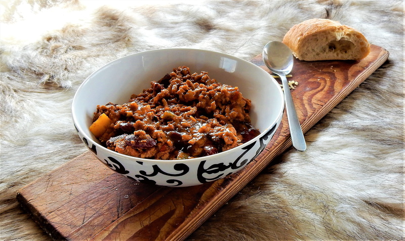 raisin, food and drink, delicious, eating utensil, black, freshness, warm, indoors, high angle view, kitchen utensil, loaf, wood - material, spoon, tasty