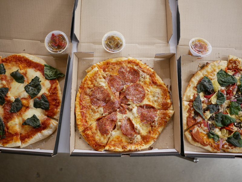 household equipment, indulgence, canada, unhealthy eating, directly above, freshness, sauce, snack, table, serving size, glass, pizza box, food, high angle view