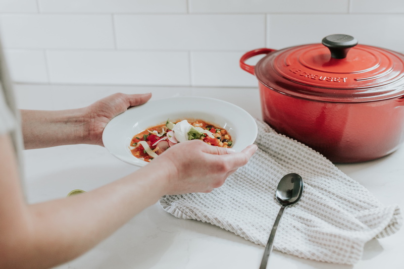 real people, hand, human, dutch oven, healthy eating, holding, indoors, kitchen utensil, food and drink, freshness, meal, finger, lifestyles, pot, pizza