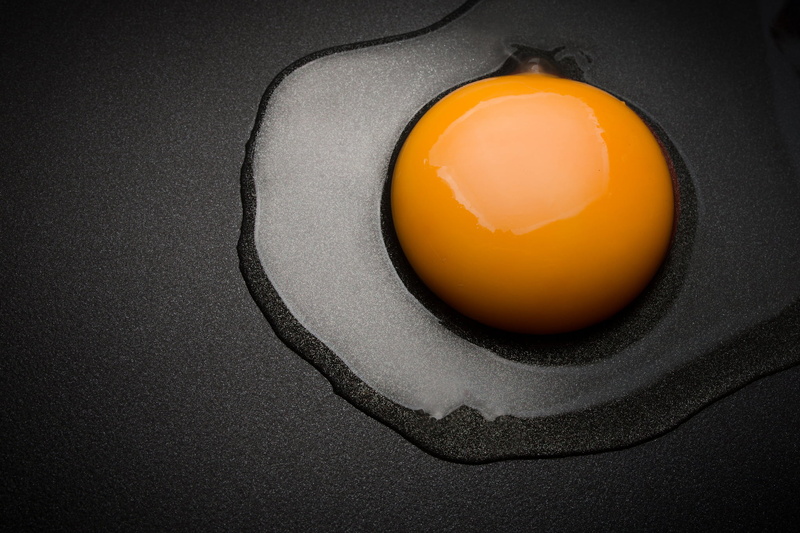 yellow, black background, food and drink, wellbeing, meal, frying pan, no people, studio shot, the yolk, surface, directly above, indoors, sunny side up