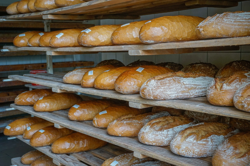 french food, food and drink, large group of objects, abundance, wellbeing, loaf of Bread, baguette, Loaf, business, baker - Occupation, baking, indoors