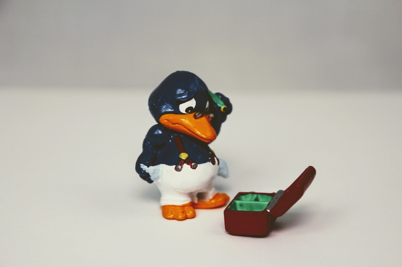 table, one animal, craft, pingu, cute, no people, human representation, figure, indoors, copy space, toy, male likeness, white background, close-up, Fitter