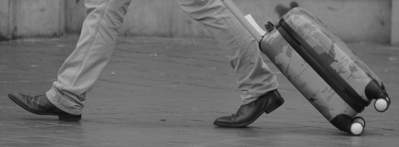 low section, holiday, flooring, lifestyles, shoe, leisure activity, dress, suitcase, real people, motion, traveler, human foot, globetrotter, outdoors