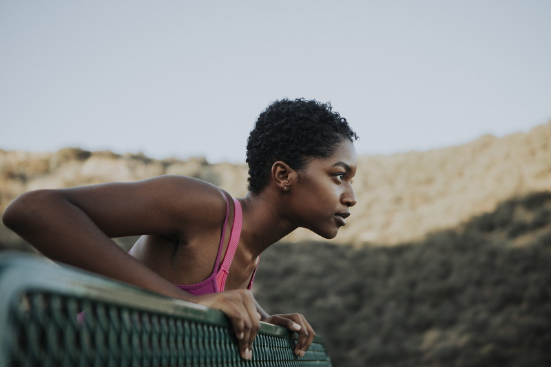 determination, girl, outdoors, hairstyle, hair, steel, daylight, sports training, person, facial expression, young adult, copy space, sports clothing, athlete