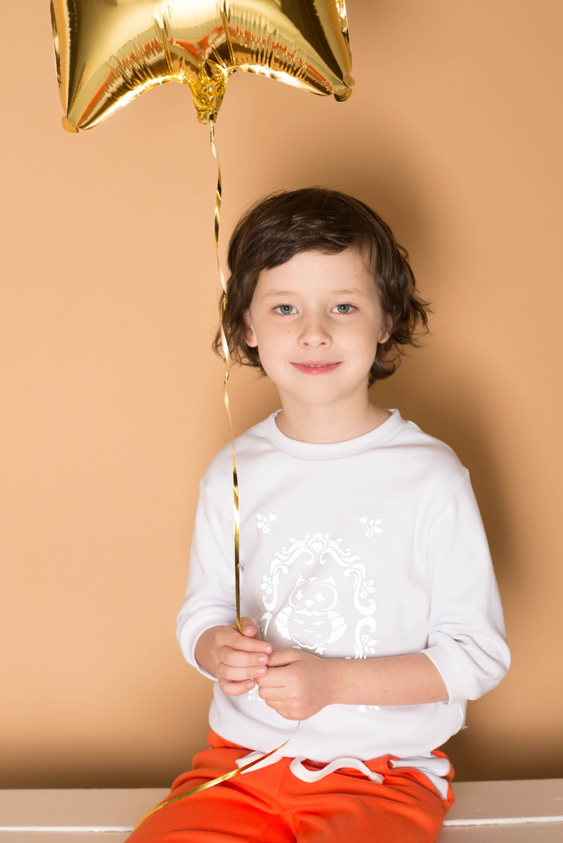 people, studio, casual clothing, innocence, posing, cute, child, beautiful, looking at camera, 6 years, advertising clothes, holding, three quarter length
