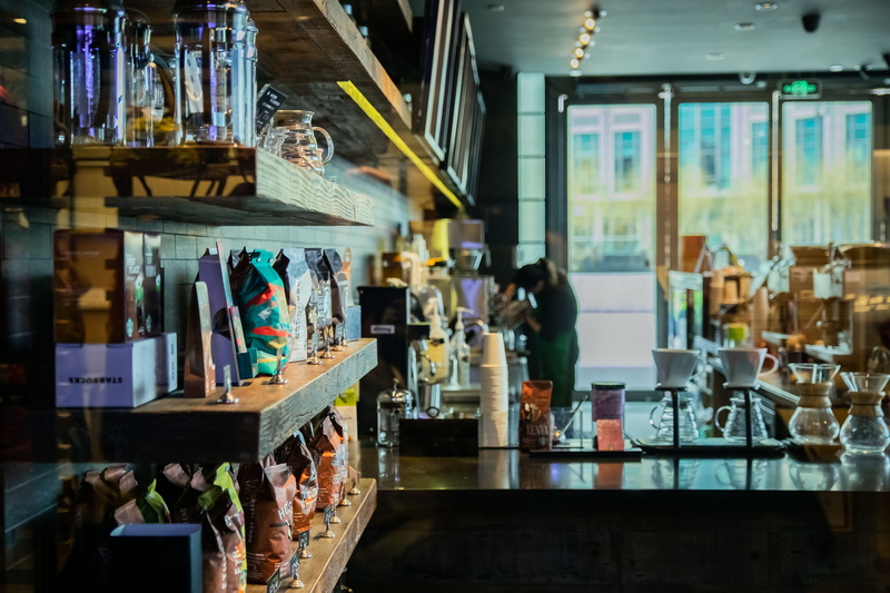 restaurant, bar counter, liquor, beverage, food, pub, indoors, person, no people, cafe, drink, store, retail, business, glass - material, large group of objects