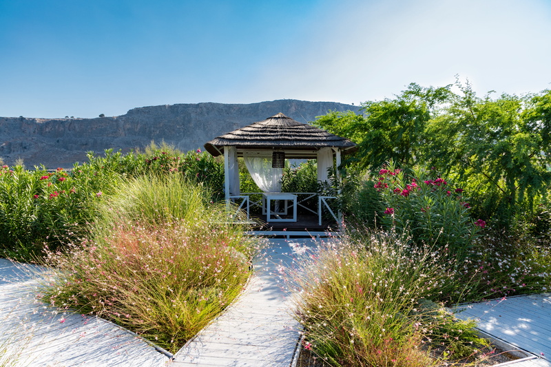 paradise, outdoors, relaxation, house, water, day, hut, travel, building exterior, garden path, cabana, landscape, building, sun, beauty in nature, wood - material