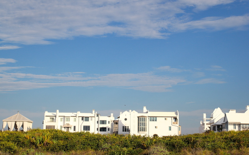 beach, building, tree, residential district, plant, landscape, land, sky, cloud - sky, built structure, beauty in nature, architecture, beach house, outdoors