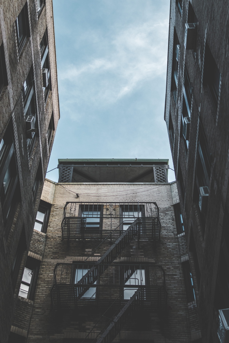building exterior, sky, symmetrical, sunlight, nature, city, built structure, downtown, low angle view, office, staircase, rise, urban, outdoors, high