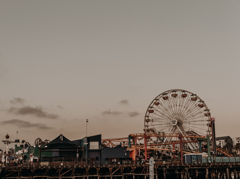 big wheel, nature, building exterior, circle, carnival, near, architecture, fairground, pier, traveling carnival, cloud - sky, funfair, leisure activity