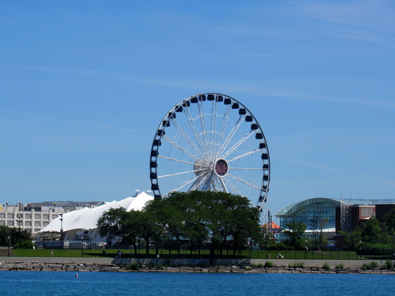 ferriswheel, amusement park, building exterior, sky, nature, arts culture and entertainment, water, outdoors, blue, built structure, amusement park ride