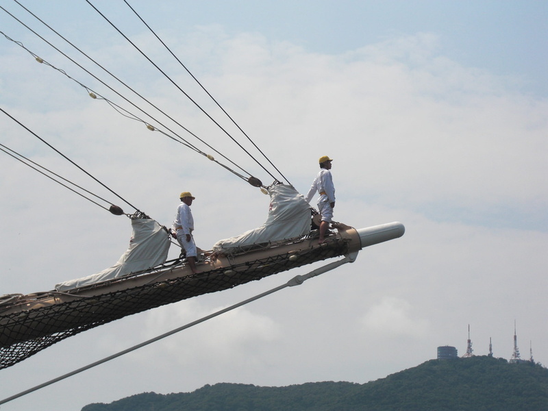 sitting, low angle view, occupation, nagasaki port, people, casual clothing, nagasaki, built structure, outdoors, day, working, men, real people, sky, nature