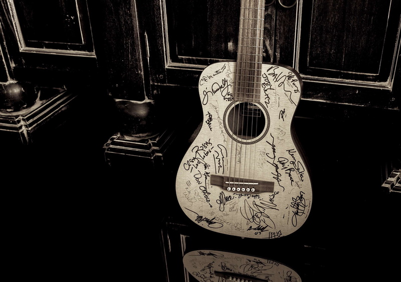 musical equipment, built structure, antique, martin guitar, history, close-up, still life, day, the past, window, autograph, musical instrument, no people