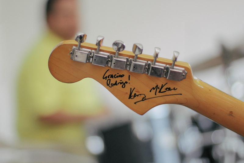 one person, selective focus, day, music, stage, musical equipment, autographed, human body part, musician, wood - material, pegs, focus on foreground, string instrument