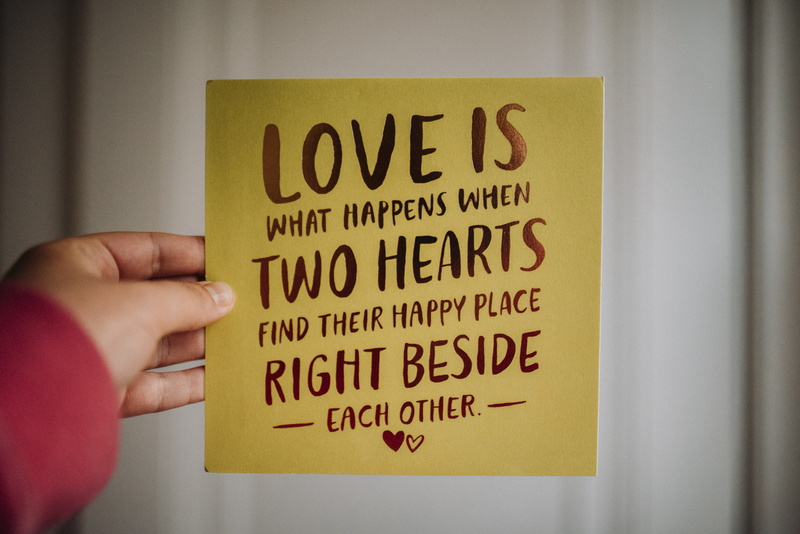 focus on foreground, human limb, human, handwriting, western script, quotes, indoors, word, plywood, hand, valentines, symbol, banner, 5K, art, close-up