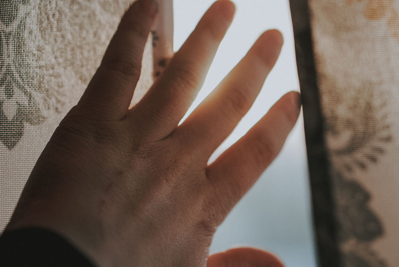 men, human limb, coffee cup, wall - building feature, daisies, hardwood, human body part, curtain, skin, contact lens, beverage, focus on foreground, daisy