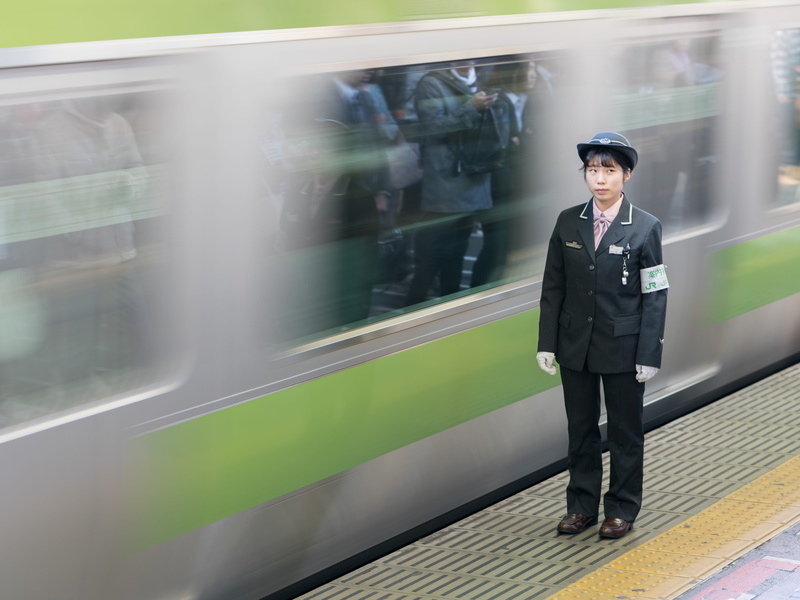 full length, tokyo, rail transportation, real people, well-dressed, one person, public transportation, shinjuku, conductor, travel, mode of transportation