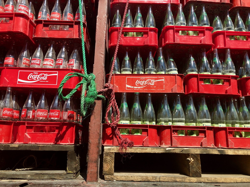 text, arrangement, outdoors, for sale, bottle, tire, machine, pop bottle, choice, transportation, abundance, red, architecture, no people, Bottles, car wheel