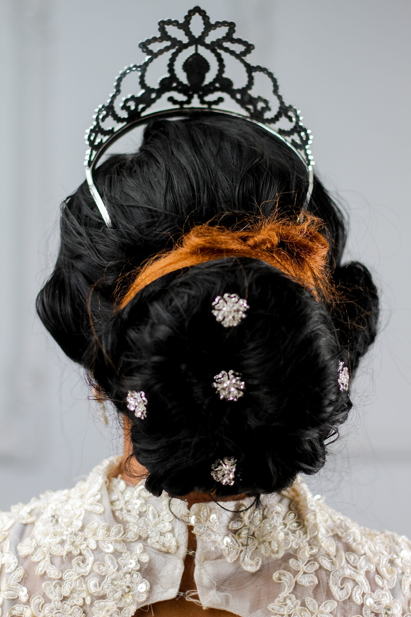 one person, clothing, hairstyle, decoration, black hair, wearing, tiara, fashion, indoors, close-up, braided hair, women, 5K, studio, portrait, adult
