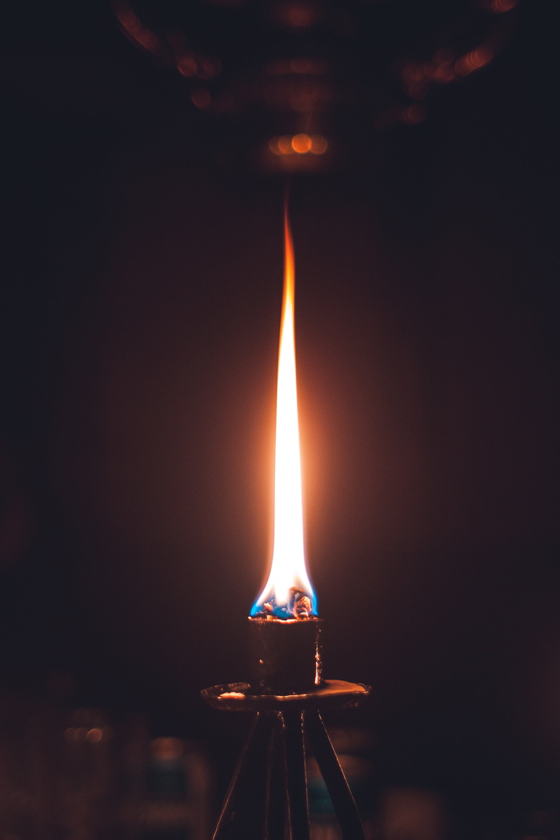backgrounds, motion, glowing, single Object, illuminated, candle, shiny, metal, red, igniting, black background, light - Natural Phenomenon, black Color