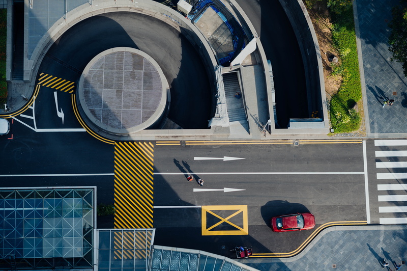 red, no people, architecture, building, sunlight, sports car, automobile, landscape, marking, 5K, day, communication, aircraft, vehicle, car, sign, intersection