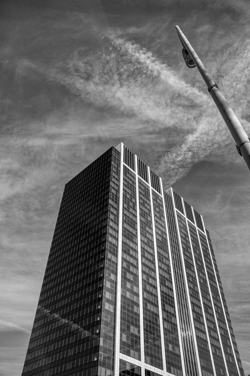 baseball bat, steeple, softball, apartment building, office building exterior, sky, office, outdoors, reflection, sport, grayscale, condo, development