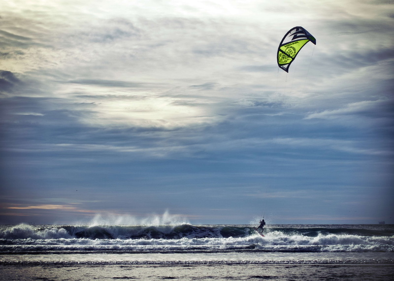wave, land, water, outdoors, kiteboarding, extreme sports, kite, parachute, sky, beauty in nature, horizon over water, unrecognizable person, kite surfing