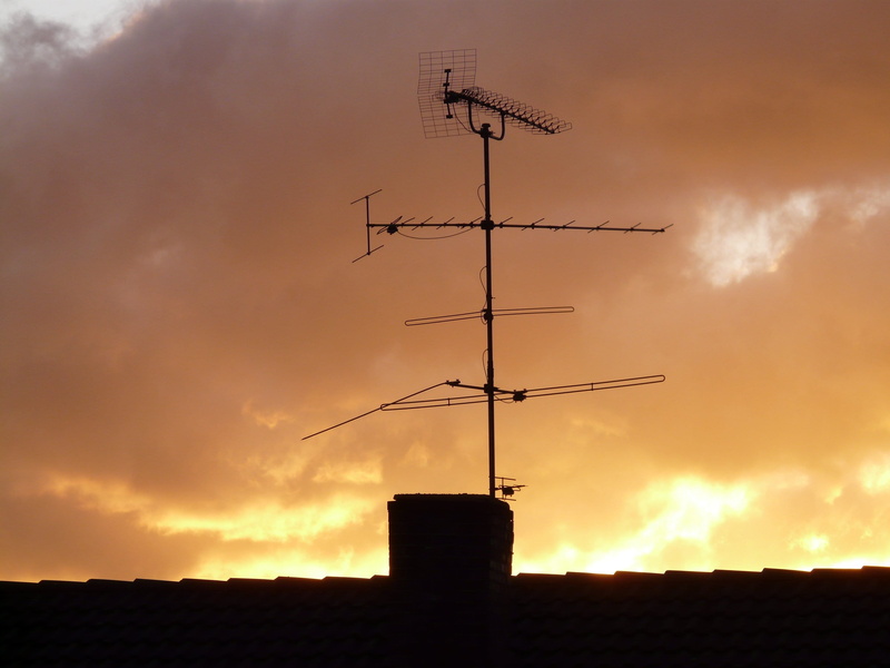 building exterior, outdoors, no people, Antenna, built structure, technology, communication, weather vane, television aerial, Send, orange color, building