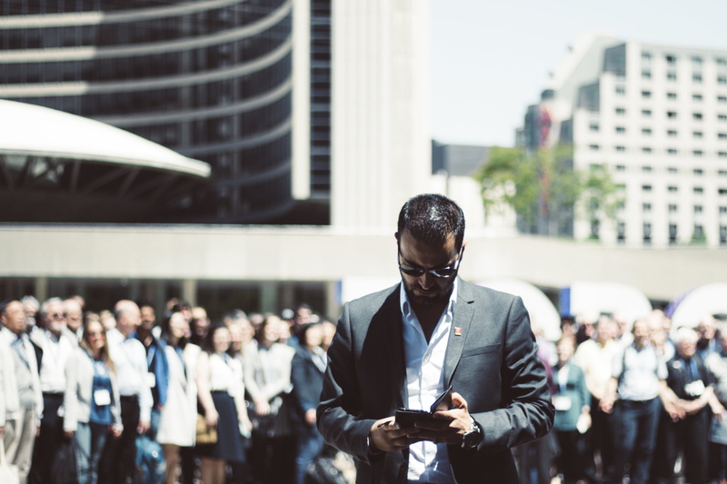 fashion, communication, formal, technology, people, man, focus on foreground, street, busy, well-dressed, suit, young adult, crowd, glasses, business, business person