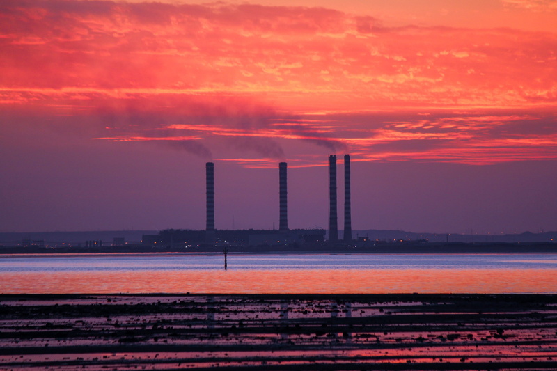 wind turbine, beach, cooling tower, outdoors, engine, building exterior, built structure, no people, motor, hour, golden, dusk, shuwaikh industrial, sea