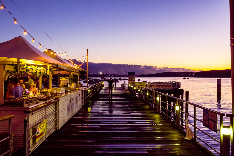 water, australia, incidental people, reflection, dusk, sunset, manly wharf, lighting equipment, sydney, transportation, built structure, manly, outdoors