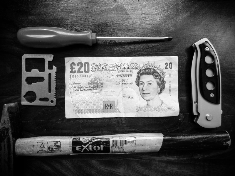 female likeness, technology, hammer, male likeness, fashion, indoors, still life, close-up, finance, paper currency, human representation, text, wealth