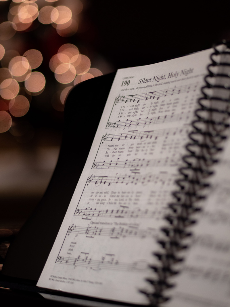 no people, silent, page, high angle view, still life, paper, musical note, holy, close-up, sheet music, night, sheet, illuminated, text, publication, musical