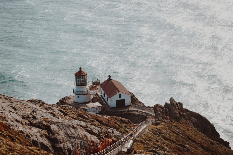 concrete, near, water, lighthouse, shipping, aerial, solid, beacon, sea, white, beauty in nature, californium, rock, mountain, wave, house, outdoors, beside