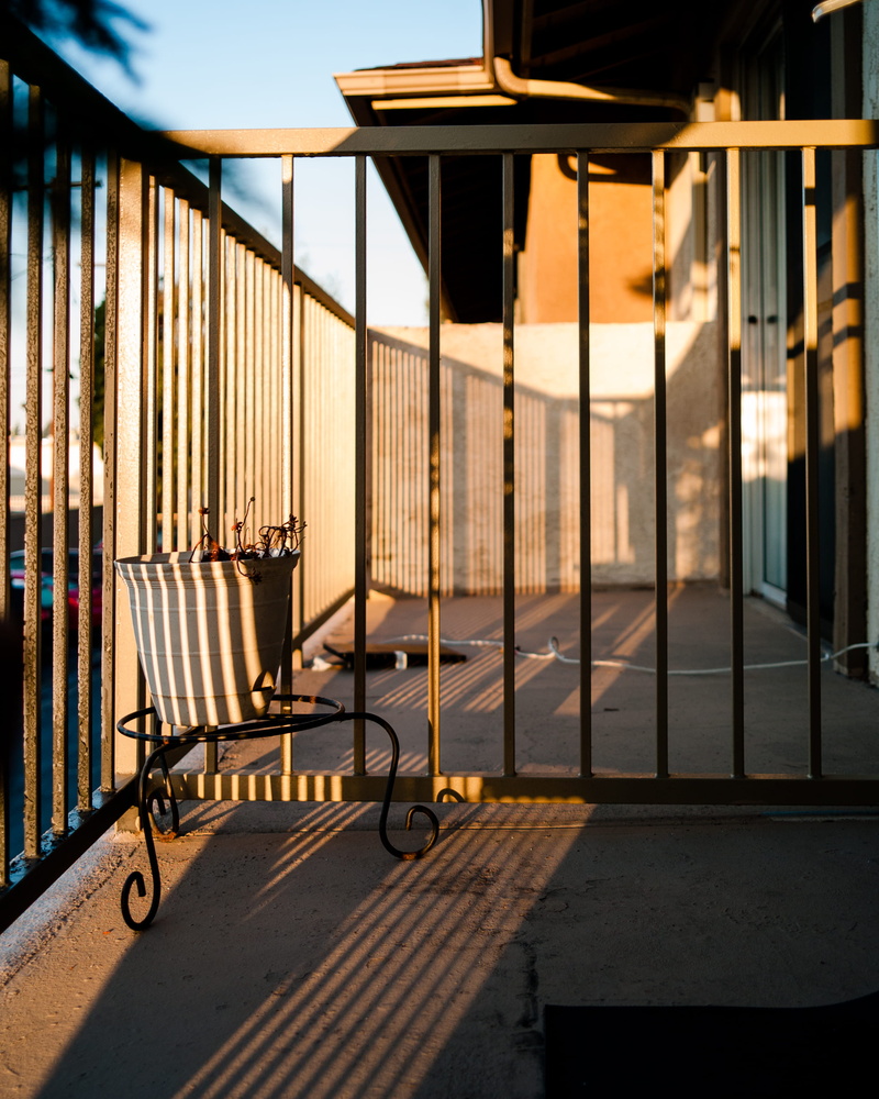 stripe, pot, city, gate, day, metal, built structure, veranda, leica, security, shadow, balcony, outdoors, absence, empty, glass - material, architecture