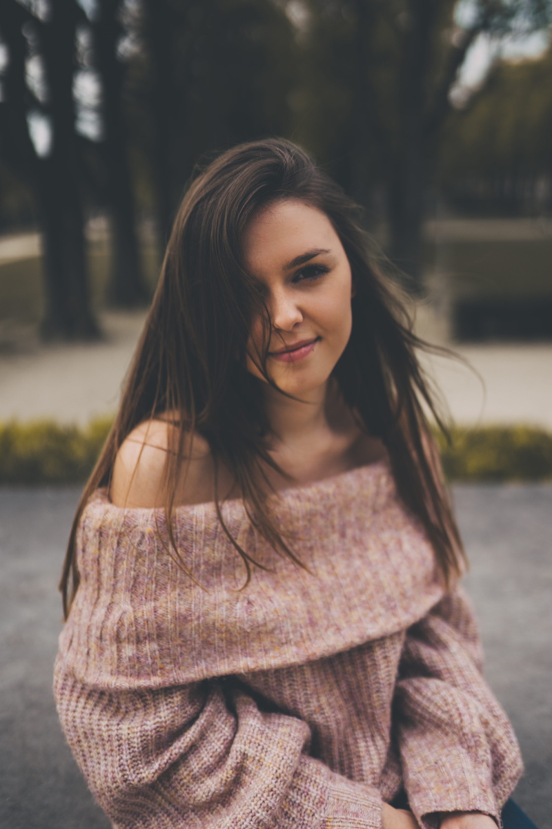 hair, long sleeve, young women, leisure activity, finger, fashion, sweater, woman, beautiful woman, one person, hairstyle, outdoors, home decor, lifestyles