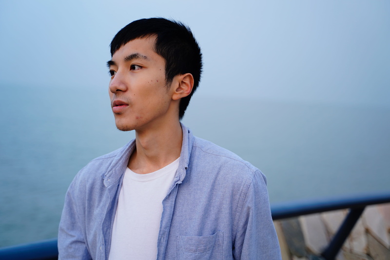 face, beak, lifestyles, person, man, boys, day, front view, photo, long sleeve, men, casual clothing, shirt, bird, headshot, one person, gray, serious