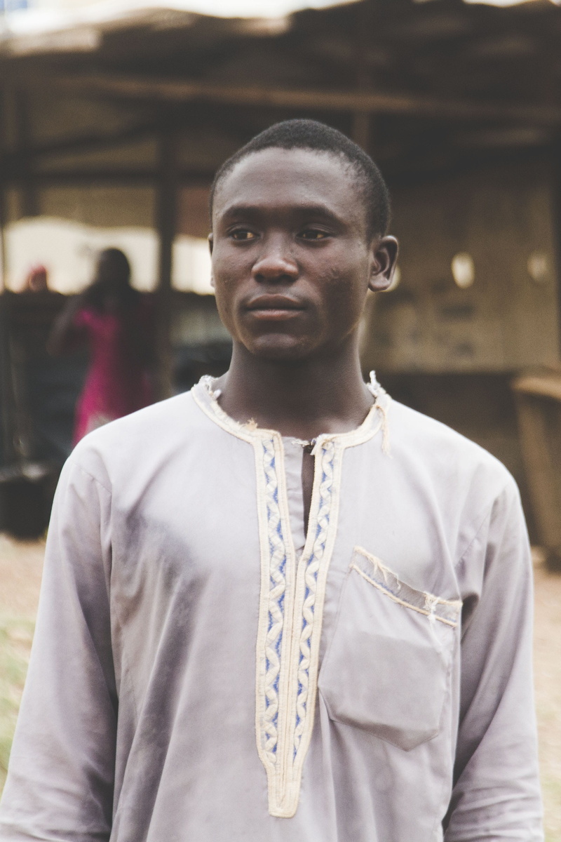 contemplation, real people, clothing, photography, teenager, grey, hausa, adult, nigeria, 2K, daytime, front view, man, bishop, one person, abuja, shirt