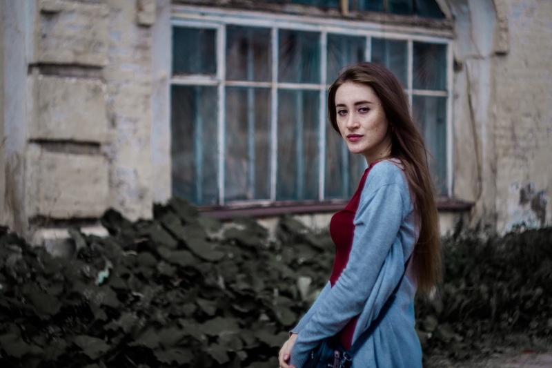 brown hair, portrait, girl, emotion, contemplation, kid, outdoors, clothing, building exterior, standing, depression - sadness, sadness, casual clothing