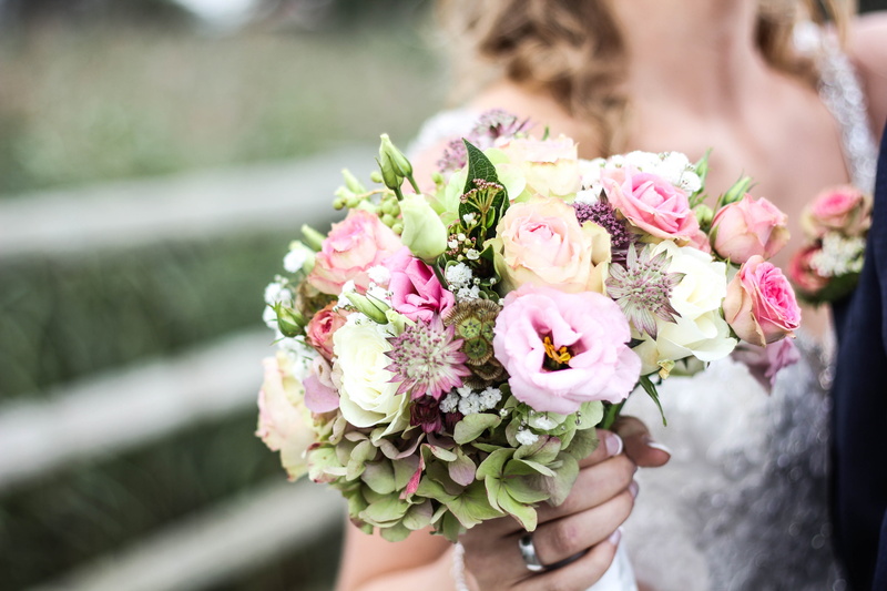 beauty in nature, ring, petal, newlywed, holding, one person, yellow, outdoors, day, woman, midsection, hand, nature, bride, wedding, beautiful woman, women