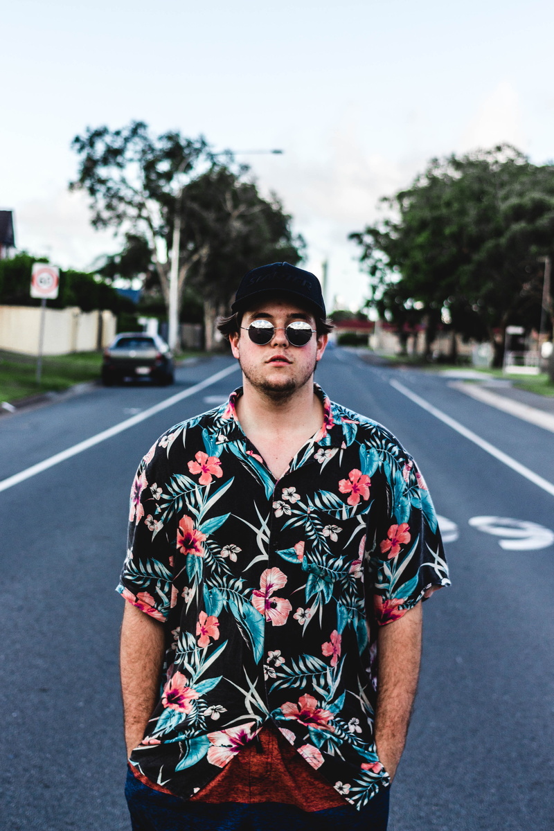 standing, young adult, 4K, city, leisure activity, road, young men, glasses, broadbeach, green, portrait, one person, front view, focus on foreground