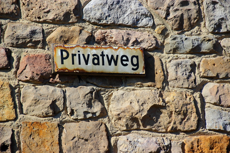 private, western script, street sign, no people, day, capital letter, information, close-up, building exterior, solid, private thing, note, stone wall