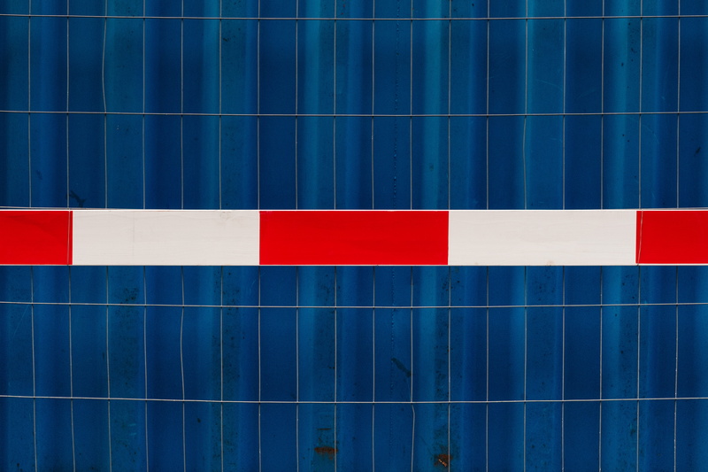 outdoors, flag, building exterior, construction, architecture, close-up, striped, fencing, rectangle, white, multi colored, minimalism, red, reflection