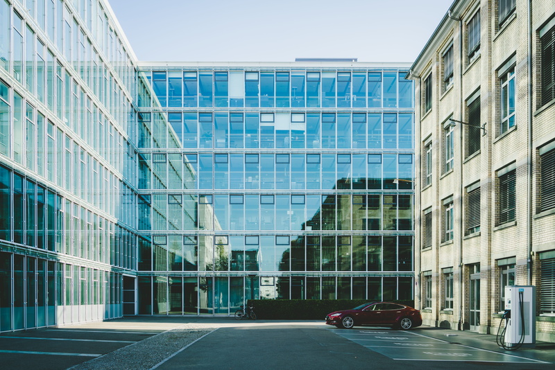 apartment building, parked, modern, day, zürich, sports car, glass - material, 8K, urban, land vehicle, skyscraper, coupe, abb historic building, office