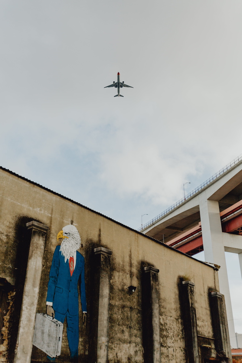 lisbon, motion, mid-air, hipster, day, architecture, lx, outdoors, portugal, human representation, cloud - sky, airplane, design, air vehicle, creative