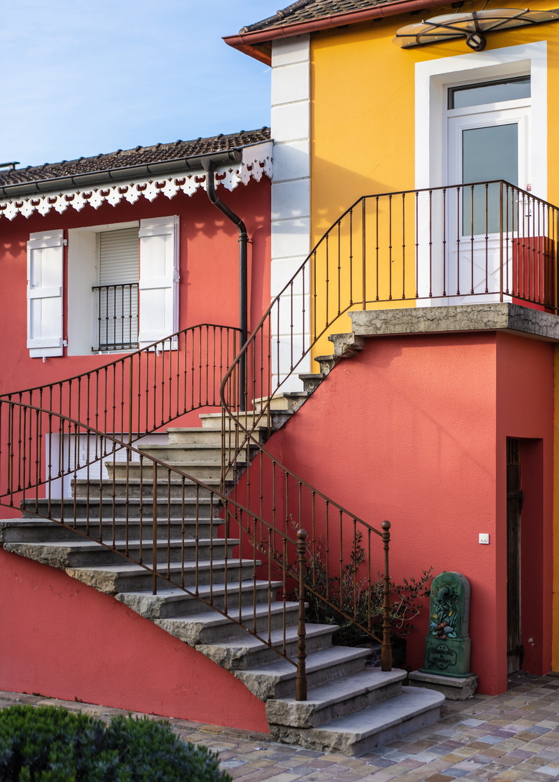 yellow, banister, no people, building exterior, shutter, security, entrance, residential district, wood, pottery, soda, curtain, orange, day, building