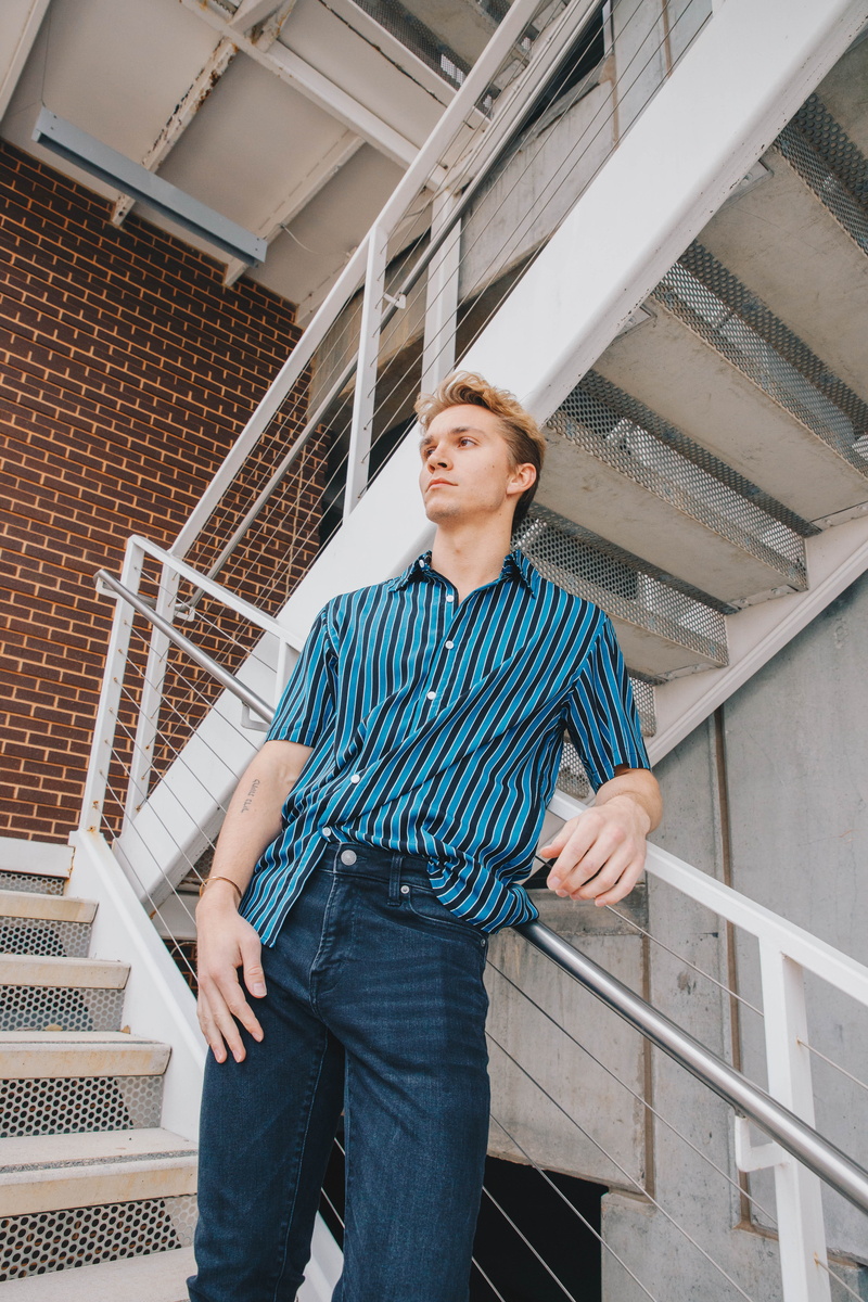 button, stairway, front view, one person, human, linen, shirt, young men, jeans, person, accessories, blouse, leaning, young adult, denim, sleeve, home decor